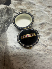 18ct yellow gold 9-stone ruby and diamond half eternity ring