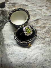 Platinum peridot and diamond cluster ring in "Art Deco" style