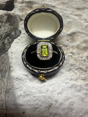 Platinum peridot and diamond cluster ring in "Art Deco" style
